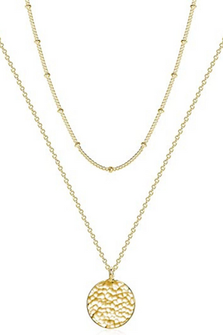women layered necklaces gold